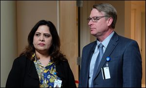 Dr. Khalida Durrani, M.D., left, with Unison Health president/CEO Jeff De Lay at the opening of a Unison Health 16-bed substance abuse recovery home on Cherry Street in June of 2017. A similar facility planned for Jefferson Avenue has met with resistance from residents and Toledo's city council. 