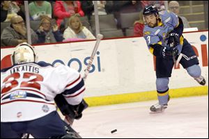 Toledo's Simon Denis (9) shoots against South Carolina's goalie Jeff Jakaitis (32).