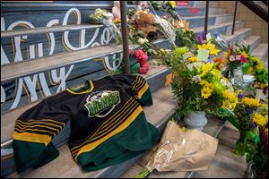 A memorial at the stairs that lead to Elgar Petersen Arena is shown in Humboldt, Saskatchewan, on April 7.