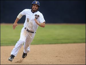 Toledo's Ross Adolph runs to third base during the first game of a doubleheader between Toledo and Bowling Green at Scott Park on Friday.