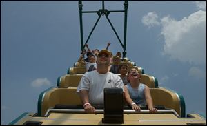 Attendees ride the Pharaoh’s Fury at the OLPH Festival in 2005. The South Toledo church recently celebrated its 100th anniversary and its final festival.