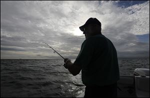 Capt. Dave Spangler of Dr Bugs Charters fishes for walleye on Lake Erie on Tuesday. For charter captains and fishers of all stripes, the fishery in northwest Ohio is one of the richest in the world.