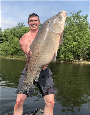 Josh Bowmar, who was a track & field All-American at Heidelberg, recently broke the state record with a 43-pound Bigmouth Buffalo sucker he shot while archery fishing on Hoover Reservoir, north of Columbus.  