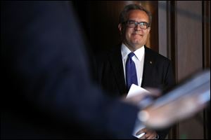 Acting EPA Administrator Andrew Wheeler smiles as he is introduced to speak to EPA staff July 11 in Washington.