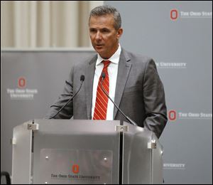 Ohio State football coach Urban Meyer makes a statement during a news conference in Columbus, Ohio, Wednesday, Aug. 22, 2018.