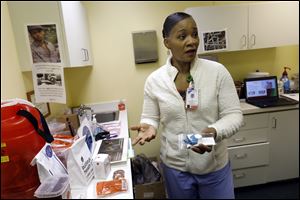 Nurse Lisa Hawthorne-Price discusses the services she provides for clients of Northwest Ohio Syringe Services at the mobil exchange located at the Talbot Center in East Toledo. The program distributes free needles, naloxone, and now fentanyl test strips to users of opioids and other drugs. It also provides various health screenings to participants too.