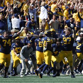 Michigan defensive lineman Aidan Hutchinson (97) celebrates a tackle in the  third quarter of an NCAA football game against Middle Tennessee in Ann  Arbor, Mich., Saturday, Aug. 31, 2019. Michigan won 40-21. (