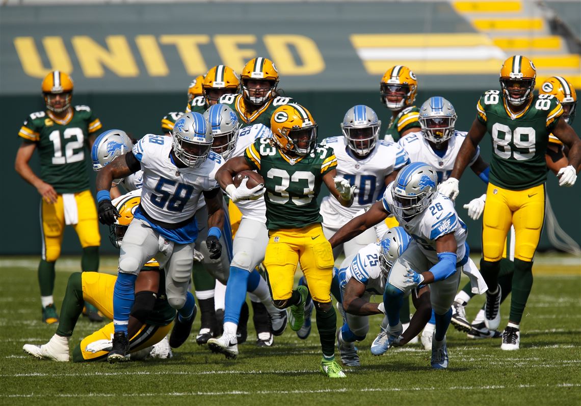 Jones scores three TDs as Packers pound Lions