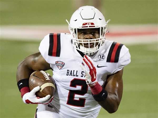 MUNCIE, IN - NOVEMBER 18: Ball State Cardinals running back Caleb Huntley  (2) steps into the end zone during the Mid American Conference college  football game between the Northern Illinois Huskies and