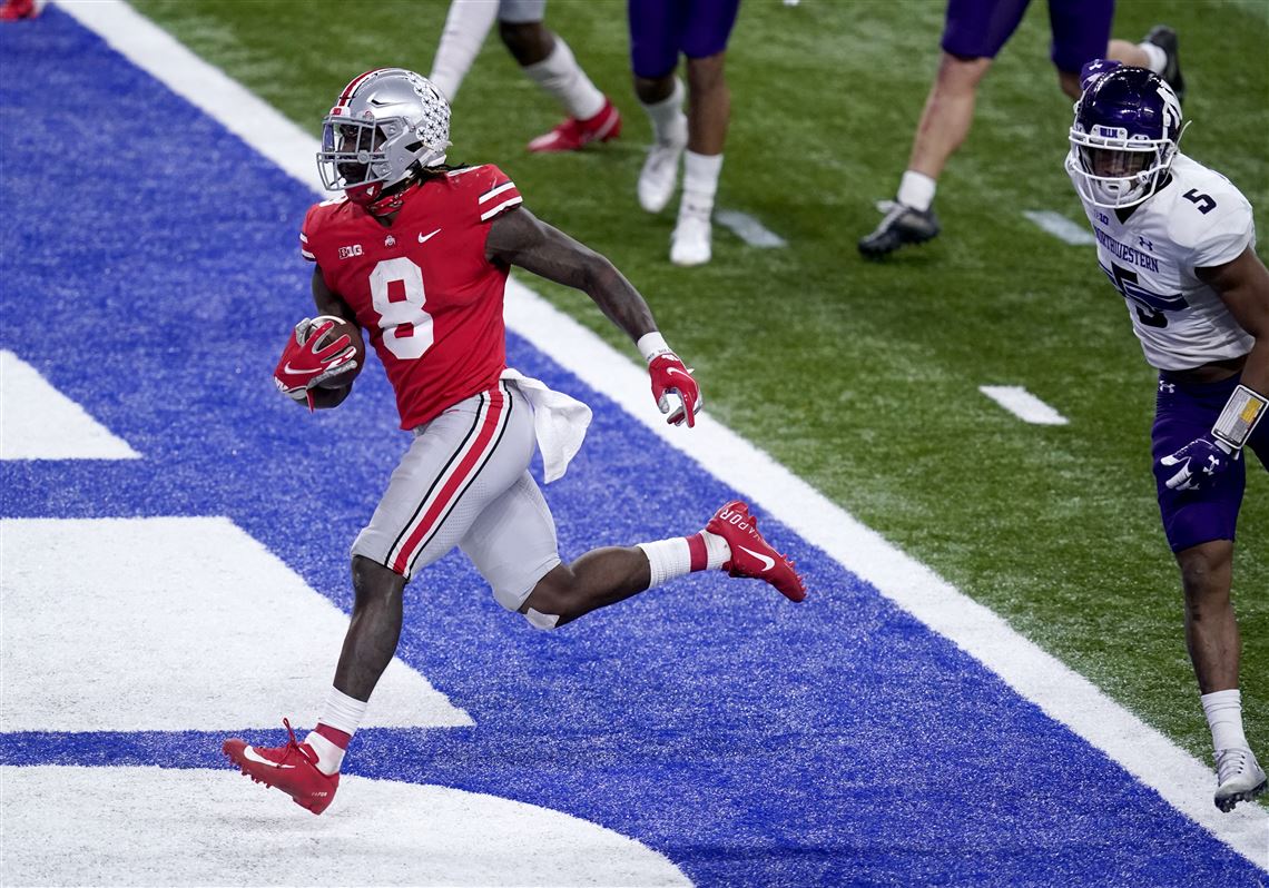 Ohio State football great Archie Griffin runs for a touchdown in the  Buckeyes' spring game 