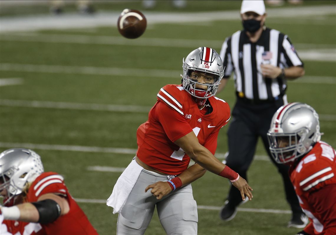 Quarterback Justin Fields of the Ohio State Buckeyes passes in the