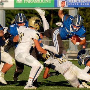 Anthony Wayneu2019s Charles Renninger (1) goes airborne while running the ball during a high school football game between Anthony Wayne and Perrysburg at Anthony Wayne High School in Whitehouse, Ohio, on Friday, Sept. 4, 2020. (THE BLADE/KURT STEISS)