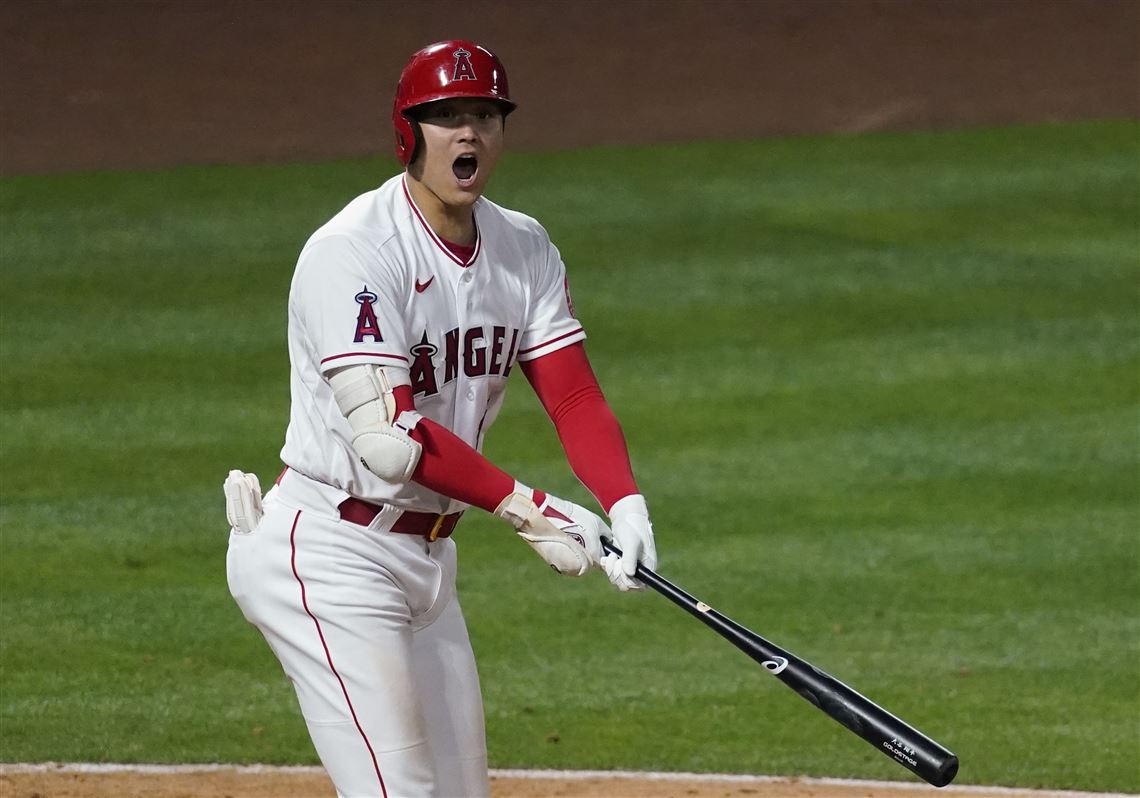 Los Angeles Angels' Shohei Ohtani (17) celebrates in the dugout