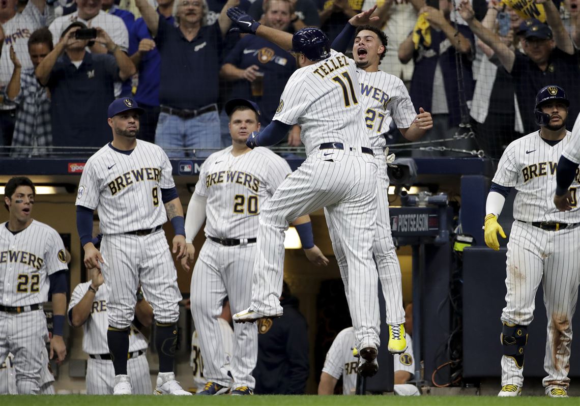 Tellez HR, throw spark Brewers over Braves 2-1 in Game 1