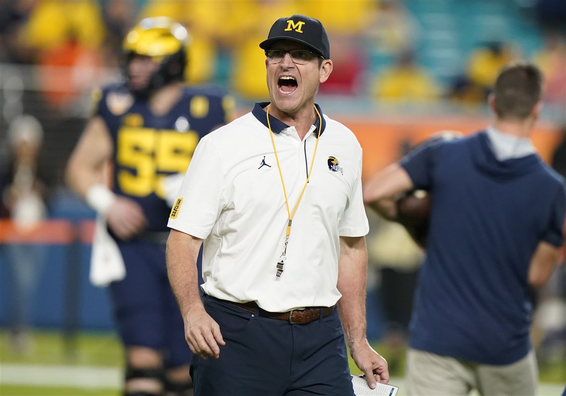 Michigan Wolverines' Jim Harbaugh interviewing with Minnesota Vikings