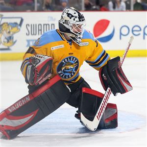 Toledo goaltender Max Milosek stops the puck during a game last season against Indy at the Huntington Center. Milosek re-signed with the Walleye before being released on Dec. 14. He has signed with Fort Wayne. (THE BLADE/KURT STEISS)