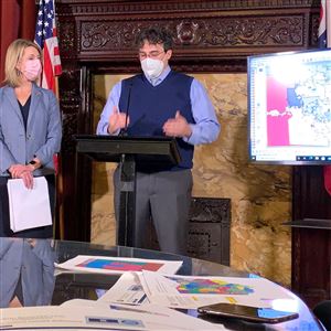 Sen. Vernon Sykes, House Democratic Minority Leader Allison Russo and map-drawing consultant Chris Glassburn discuss Democratic proposed maps for state legislative districts. (THE BLADE/JIM PROVANCE)