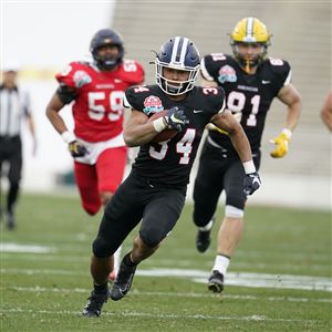 American Team running back Bryant Koback runs during the first half of the NFLPA Collegiate Bowl college football game against the National Team Jan. 29 in Pasadena, Calif.