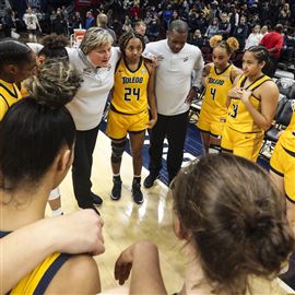 Toledou2019s head coach Tricia Cullop huddles with her team after falling to Ball State in the semifinal game of the MAC womenu2019s basketball tournament at Rocket Mortgage FieldHouse in Cleveland on March 11.