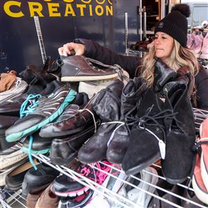 Stacie Sime of Northwood helps organize footwear.