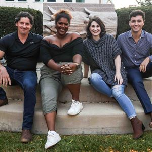 Resident artists Imara Miles, from left, Brendan J. Boyle, Matthew Payne, and Sara Mortensen gather on Oct. 2 at the Valentine Theatre in Toledo. Steven Naylor, not photographed, is the collaborative pianist and a fifth resident artist.  (THE BLADE/ISAAC RITCHEY)