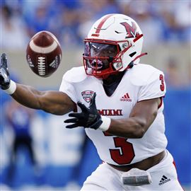 Miami Ohio running back Keyon Mozee reaches out and makes a catch during the first half of an NCAA college football game against Kentucky in Lexington, Ky., Sept. 3.