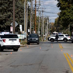 Police block off Upton Avenue in between  Mansfield Rd. and Fairfax Rd. in West Toledo to investigate a shooting that struck three, leaving one in critical condition in Toledo, Ohio on Oct.15. Police said the shooting happened around 10:30am this morning. 