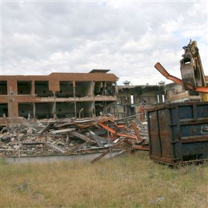 Toledo Public School demolition of the former Harriet Whitney Vocational Technical High School was nearly completed in 2011.  (THE BLADE/LISA DUTTON )