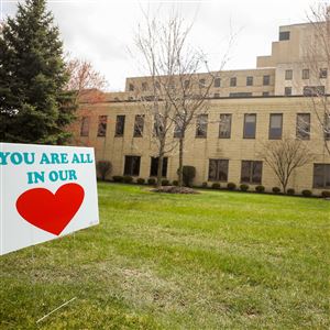 A supportive sign is posted outside of Mercy Health St. Charles Hospital in Oregon.