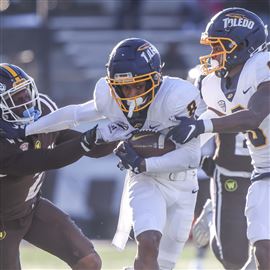 October 5, 2019: Western Michigan LeVante Bellamy #2 tries to shake off a  Toledo defender during the NCAA football game between the Toledo rockets  and the Western Michigan Broncos at the Glass