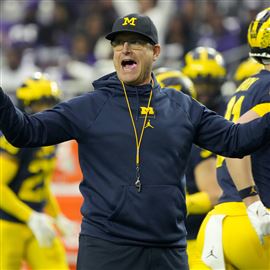 Michigan football dodges disaster by keeping Jim Harbaugh; the