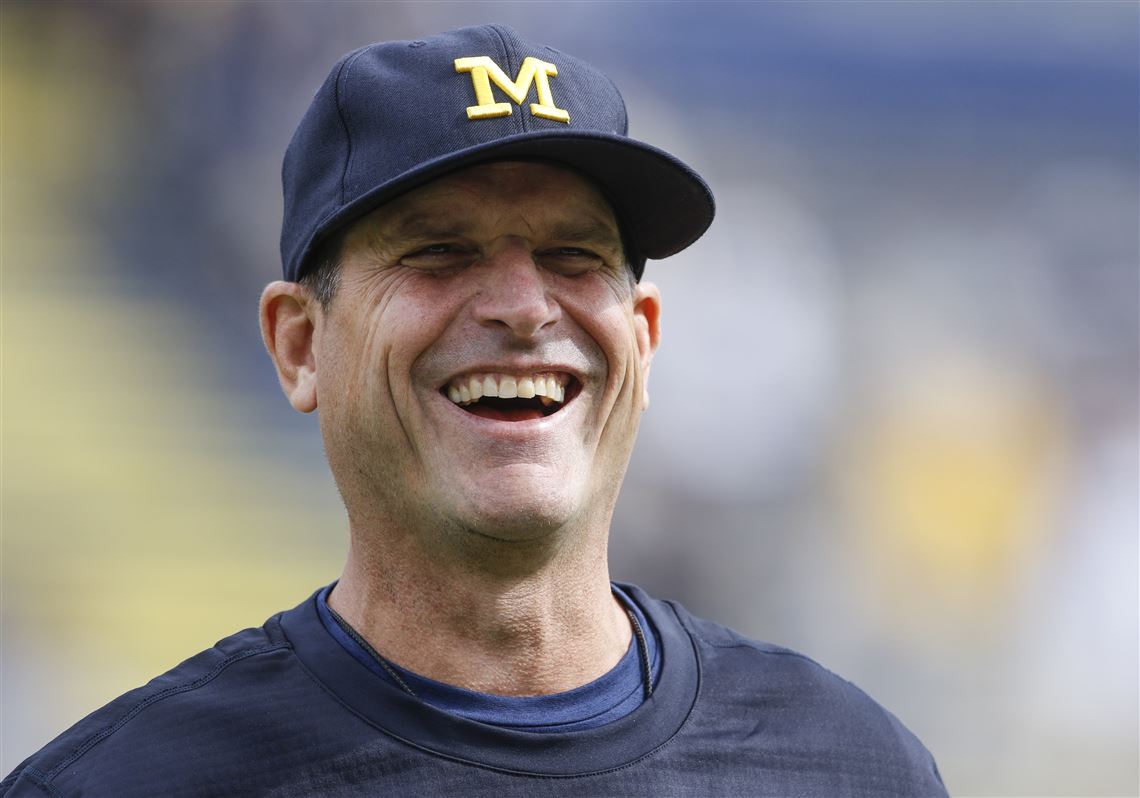 Jim Harbaugh calls Michigan president to say he's staying