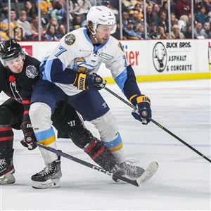 Toledo Walleye forward Sam Craggs receives a pass against the Indy Fuel in an ECHL hockey game on Dec. 10 at the Huntington Center in Toledo.  (BLADE/ISAAC RITCHEY)