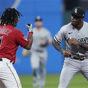 Cleveland Guardians' Kole Calhoun, right, is greeted at the plate by Jose  Ramirez (11) after hitting a home run against the Cincinnati Reds during  the third inning of a baseball game Tuesday