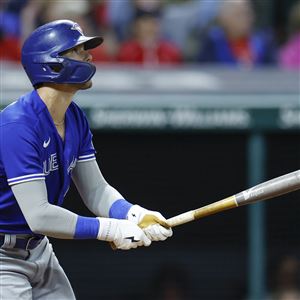 Cleveland Guardians' Kole Calhoun, right, is greeted at the plate by Jose  Ramirez (11) after hitting a home run against the Cincinnati Reds during  the third inning of a baseball game Tuesday