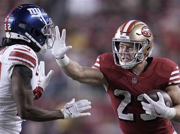 Christian McCaffrey and the 49ers win 13th straight in regular