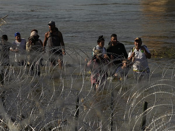 As Migrants Overwhelm Texas City, Others Wait In Mexico For ...