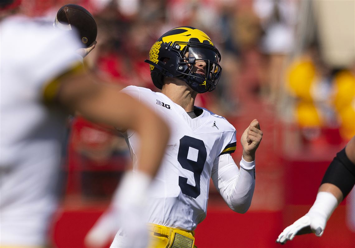 Michigan's JJ McCarthy backs suspended Jim Harbaugh with T-shirt message