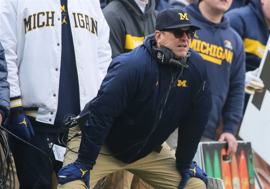 Michigan's Harbaugh says he would take less salary if it meant