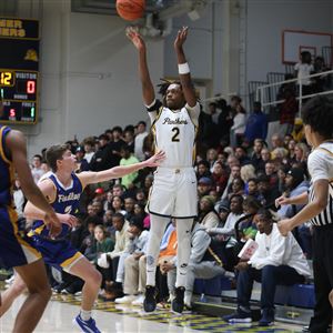 Whitmeru2019s Antione West takes a shot during a game against Findlay at Whitmer High School in Toledo on Dec. 22.  (THE BLADE/KURT STEISS)