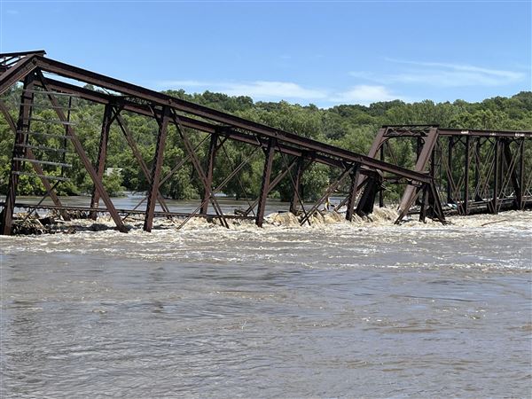 More rain forecast for drenched Midwest, Big Sioux flooding sinks rail bridge