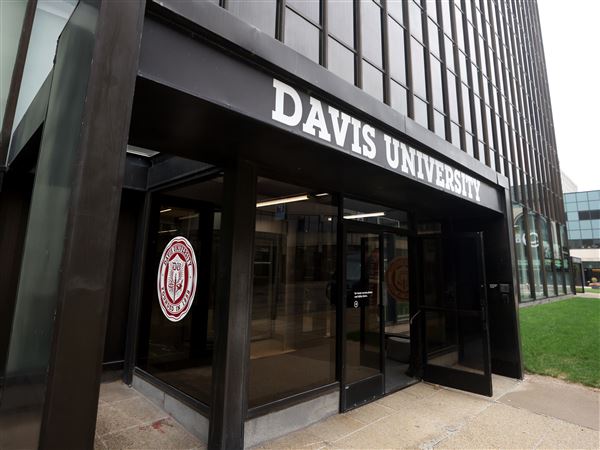 Photo Gallery: Ribbon cutting ceremony for Davis University on N. St. Clair Street