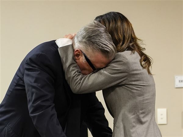 Alec Baldwin weeps when judge announces involuntary manslaughter case dismissed