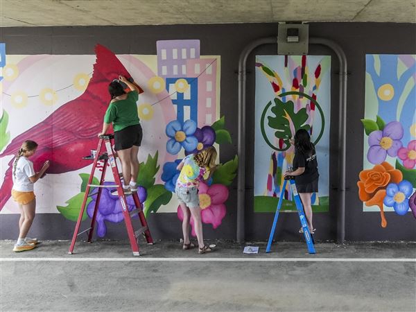 Photo Gallery: Students add final details to mural on Harroun Park Trail