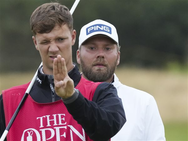 Dan Brown makes late birdies for a 1-shot lead in wind-challenged British Open