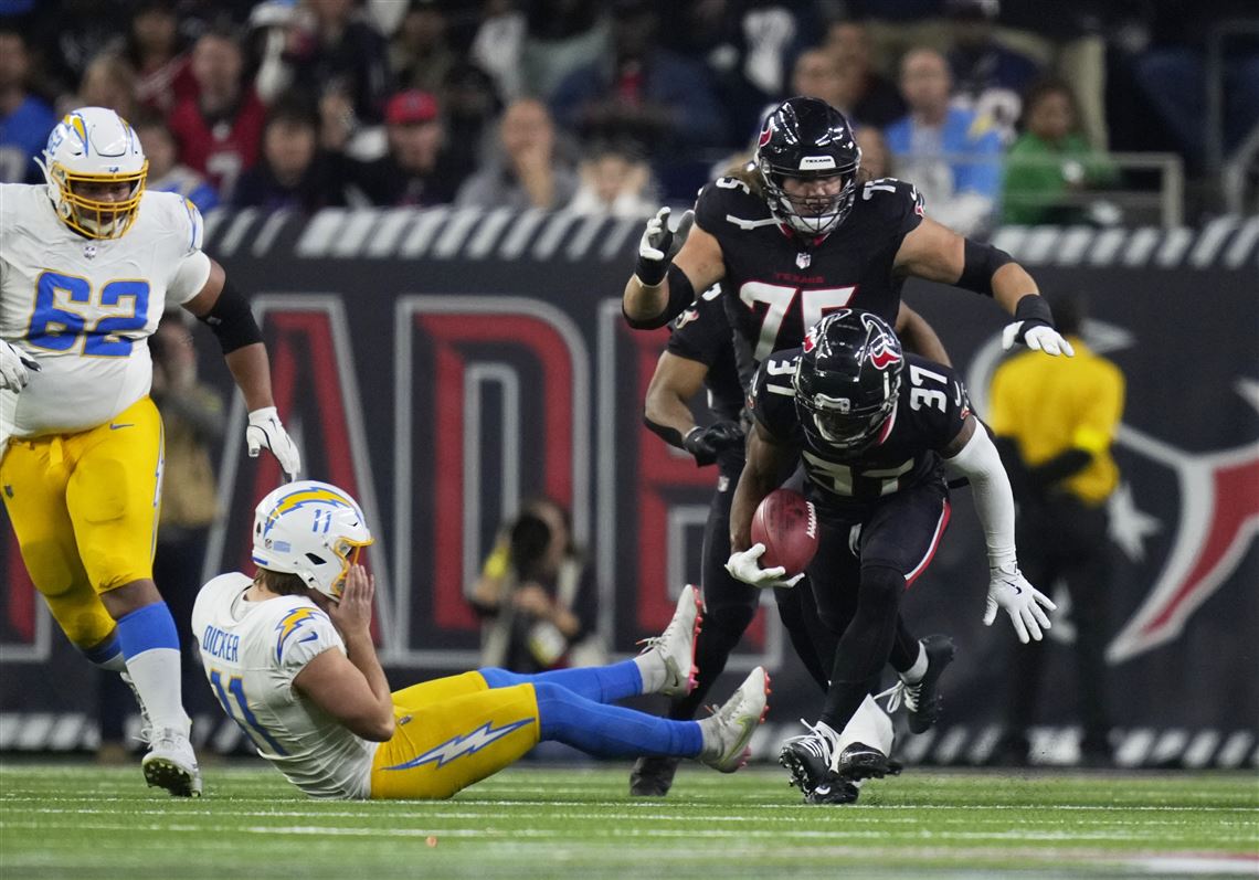 Texans intercept Herbert a career-high 4 times in a 32-12 win over Chargers  in wild-card playoff | The Blade